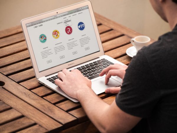 a person typing on a laptop