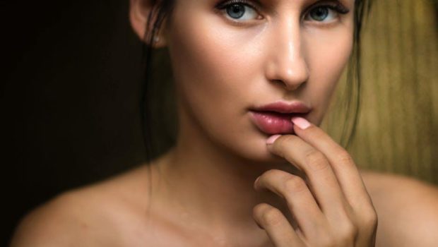 Photo Of Woman Holding Lips