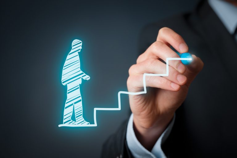 A person wearing a suit and tie Description automatically generated