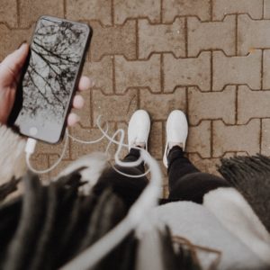 person standing while holding phone