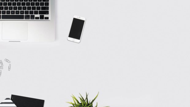 White Smartphone Beside Silver Laptop Computer