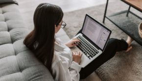 Woman Working At Home Using Her Laptop