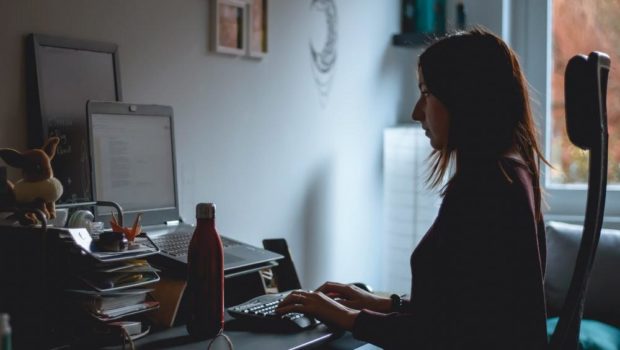 woman in black long sleeve shirt using computer